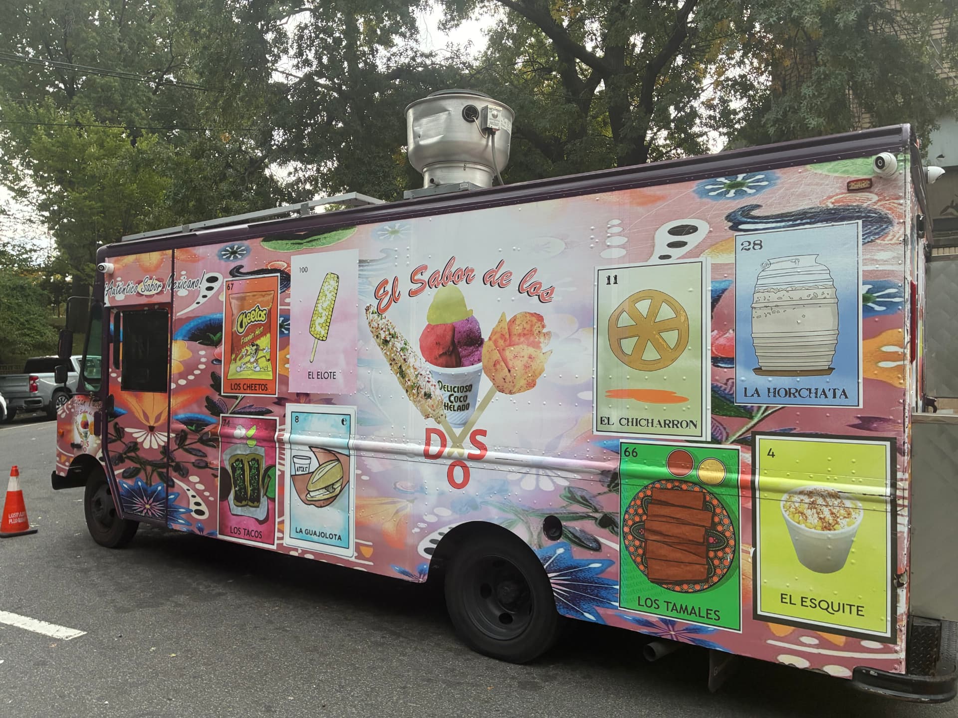 The El Sabor de los Dos food truck with a hand-painted wrap of Mexican Lotería menu cards